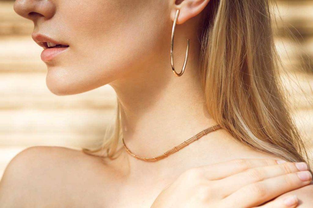 Close Up Of A Beautiful Young Blonde Woman's Neck Without A Shir